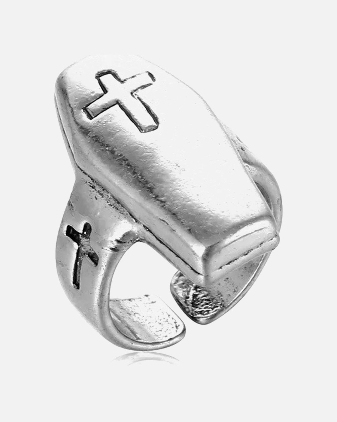 Polished silver coffin cross ring on a grey background