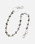 Dice Link Pants Chain – silver pants chain with black and white dice, product photo on grey background
