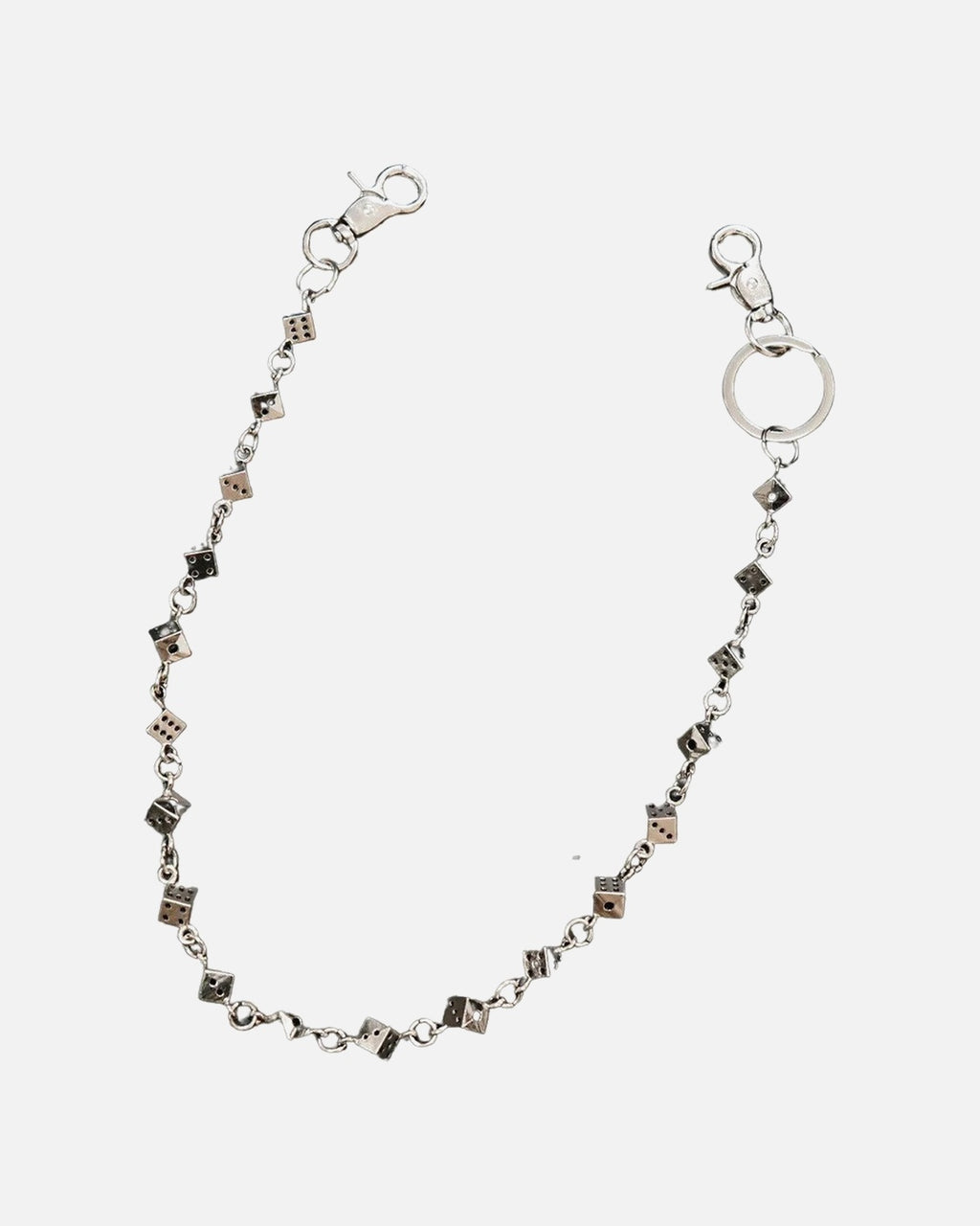Dice Link Pants Chain – silver pants chain with black and white dice, close-up detail