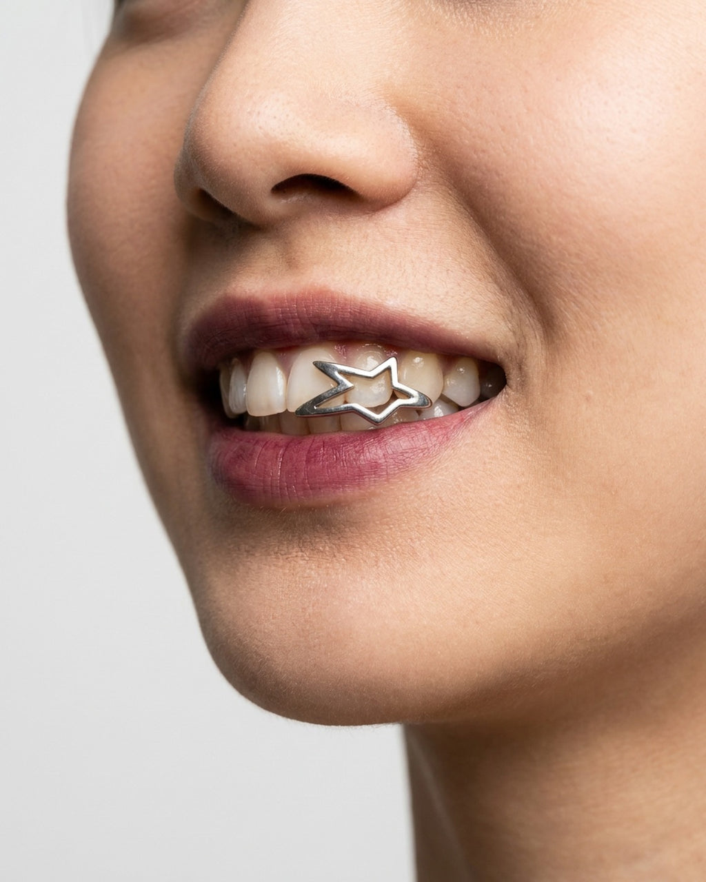 Open Star Grillz worn – cut-out star tooth grill styled in a streetwear outfit