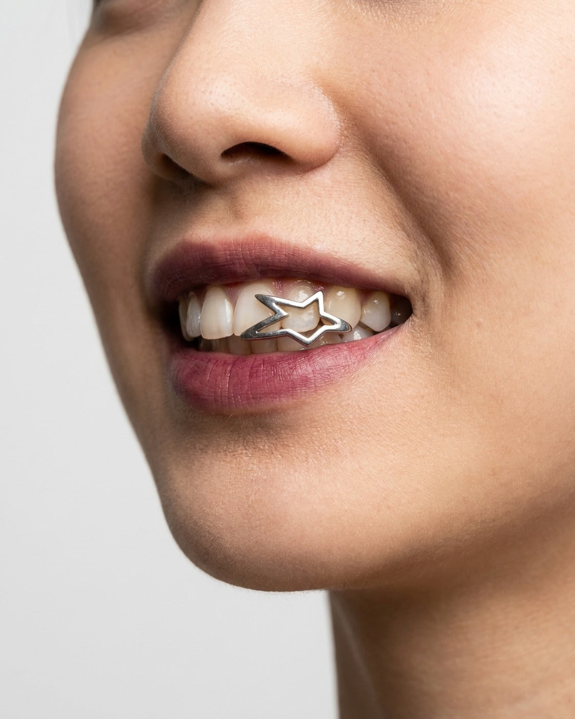 Open Star Grillz worn – cut-out star tooth grill styled in a streetwear outfit