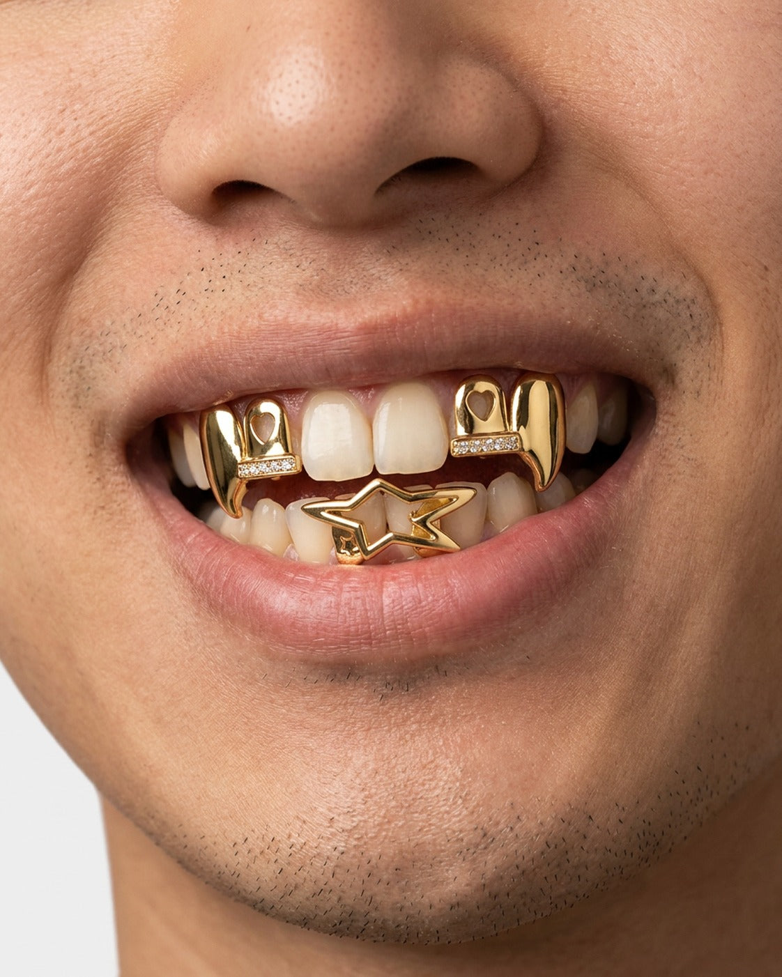 Star Fang Grillz Set worn – three-piece star and fang grillz set styled in a streetwear outfit