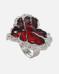Molten Red Heart Ring – red enamel heart ring in molten antique silver, product photo on grey background