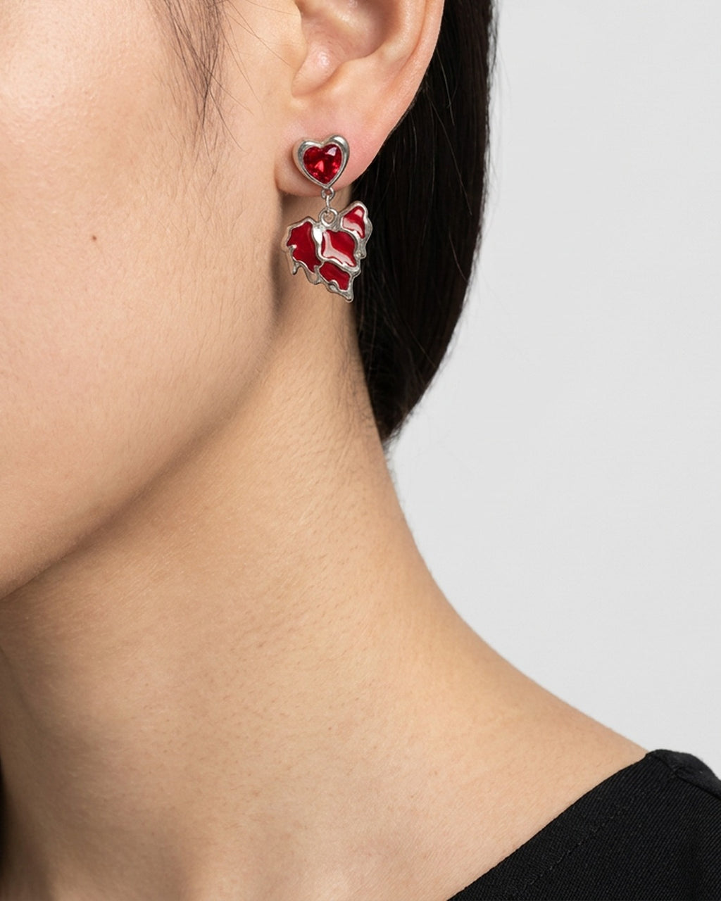 Molten Heart Earrings worn – red and black molten heart earrings
