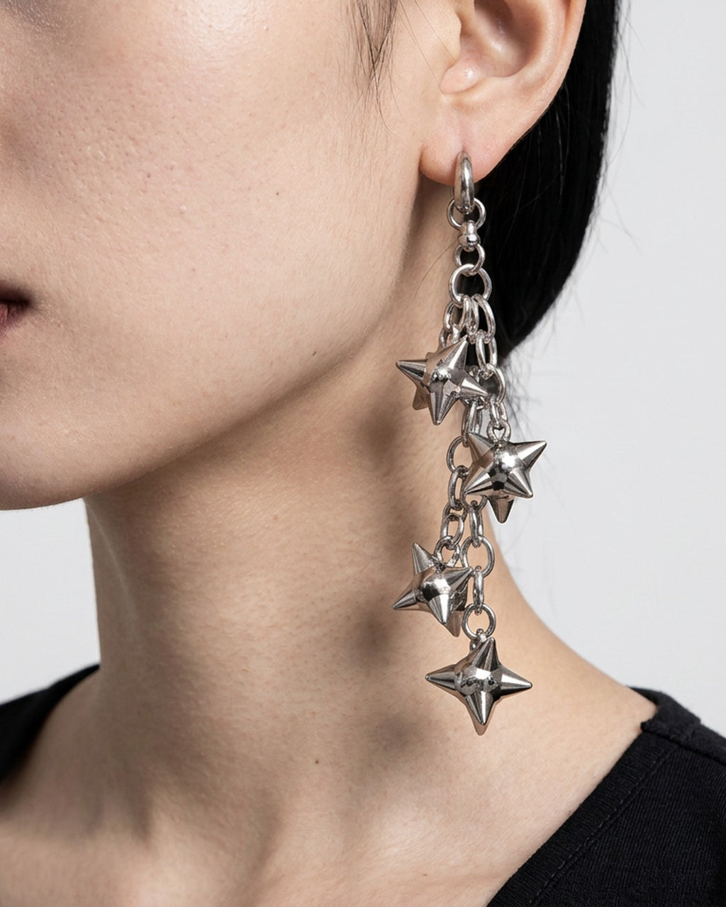 Spiked Star Chain Earrings worn