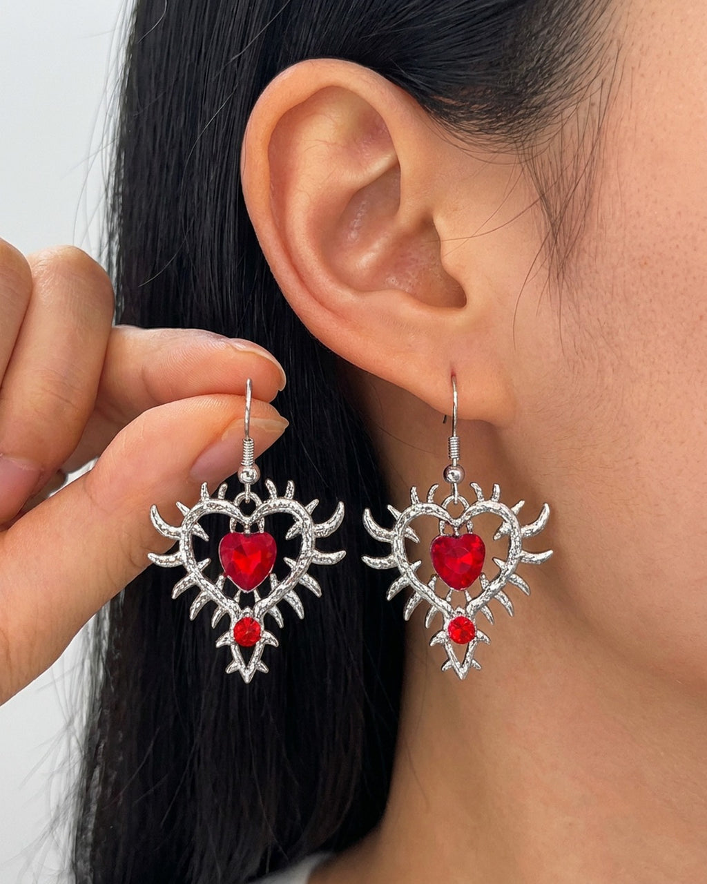 Thorn Heart Earrings worn – Red – rhinestone heart earrings in thorn frame