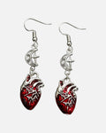 Moon Heart Drop Earrings – anatomical heart and crescent moon drop earrings, product photo on grey background