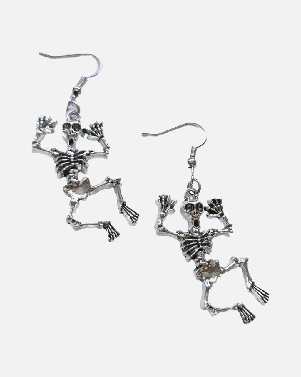 Dancing Skeleton Earrings – jointed dancing skeleton earrings, product photo on grey background