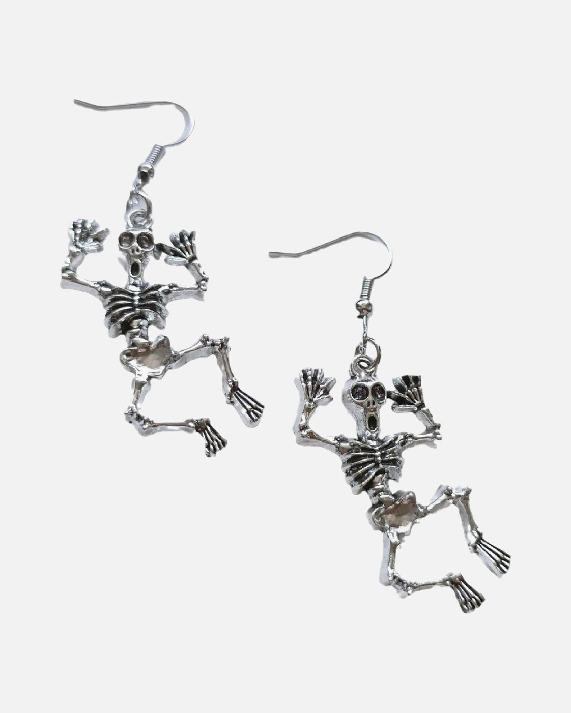 Dancing Skeleton Earrings – jointed dancing skeleton earrings, product photo on grey background