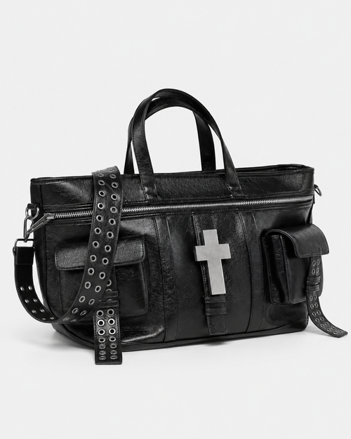 Punk Black Cross Tote Bag – black PU leather tote bag with silver cross and rivets, product photo on grey background