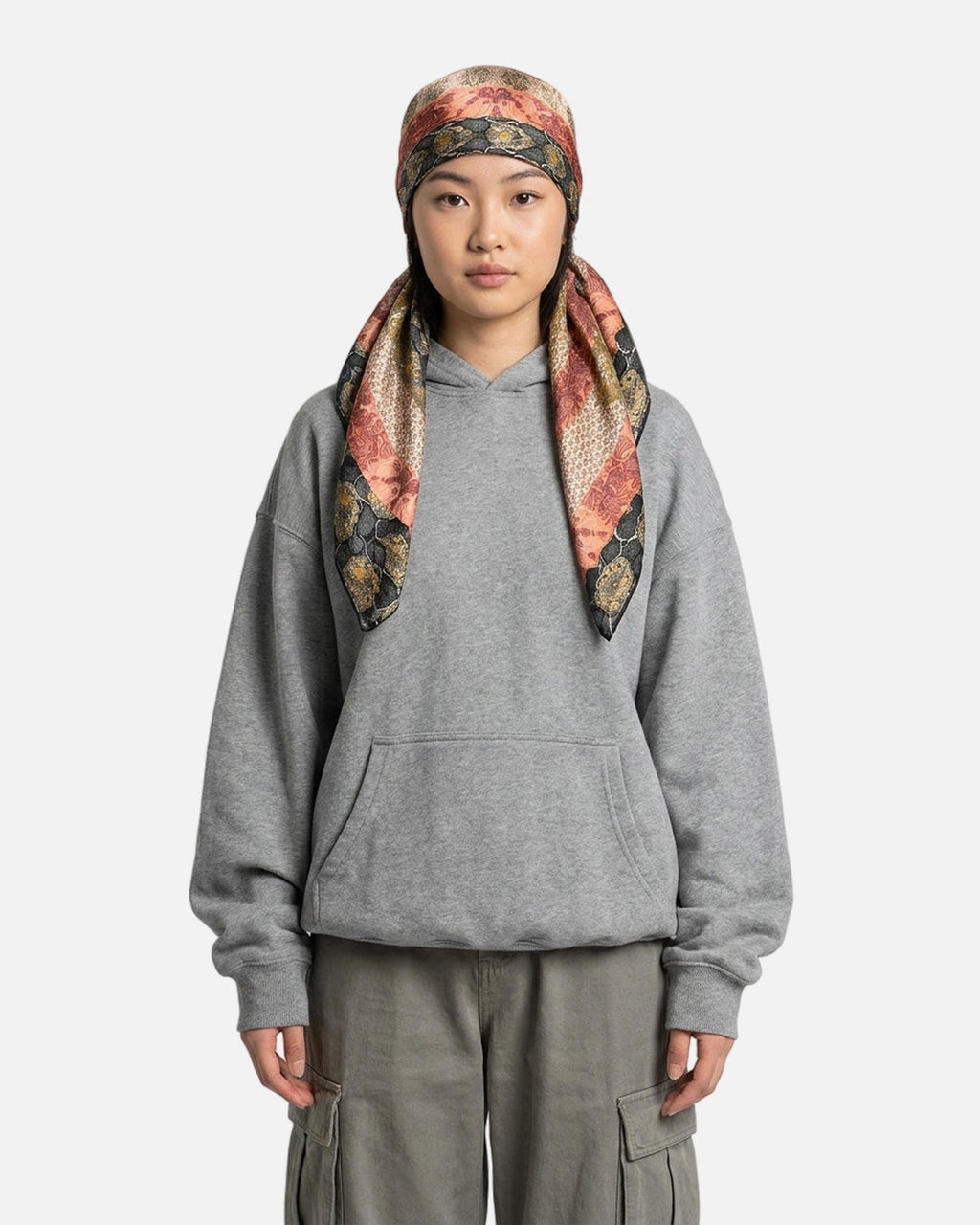 Striped Paisley Satin Scarf worn as a headscarf – styled with a grey hoodie and cargo pants