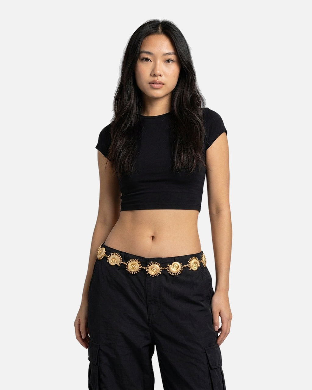 Conch Shell Waist Chain in Gold worn on the waist – styled with a black crop top and cargo pants
