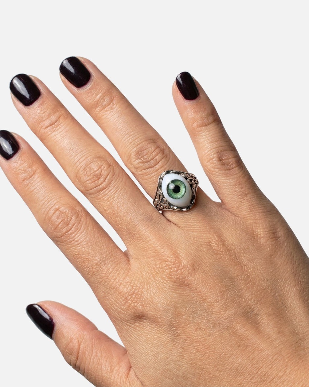 Eyeball Ring worn on the finger – unisex gothic ring styled with black nails