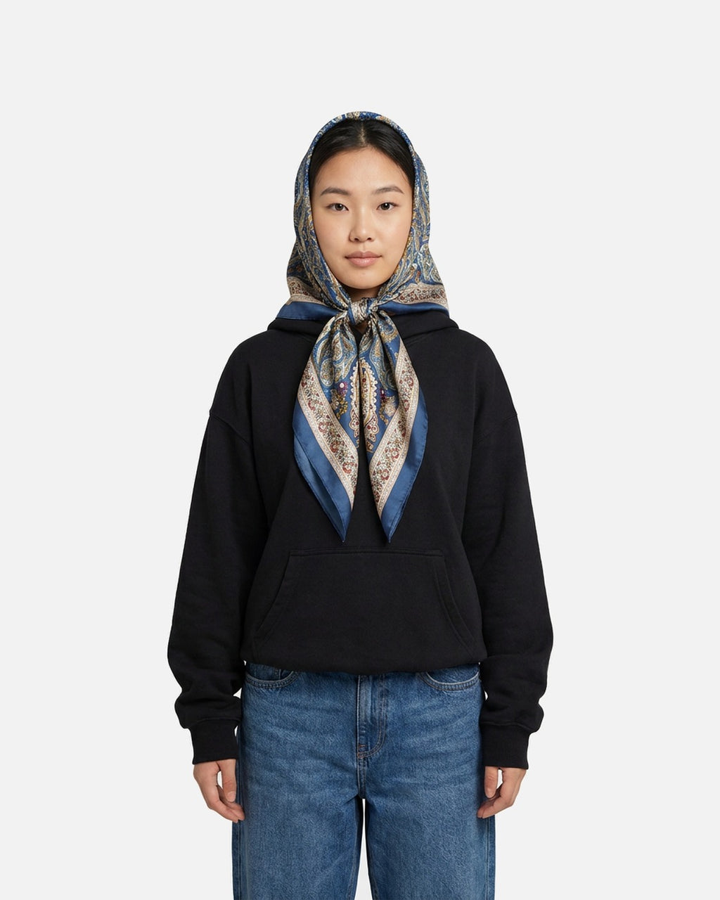 Paisley Satin Square Scarf worn as a headscarf tied under the chin – styled with a black hoodie and jeans