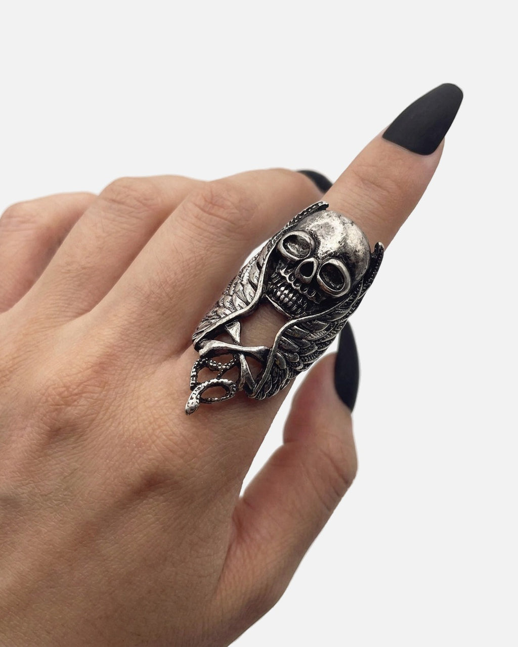 Skull Feather Armor Ring worn on the finger – unisex gothic armor ring styled with black nails