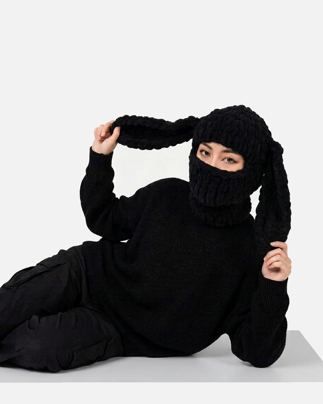Black Long Ear Bunny Balaclava worn – black long ear bunny knit balaclava styled in a streetwear outfit