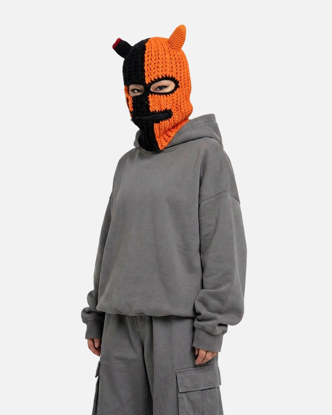 Half Devil Horn Balaclava – worn – black and orange half devil horn knit balaclava