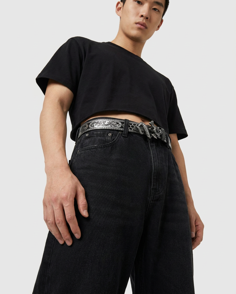 Coiled Snake Embossed Belt – black embossed belt with coiled snake buckle, close-up detail